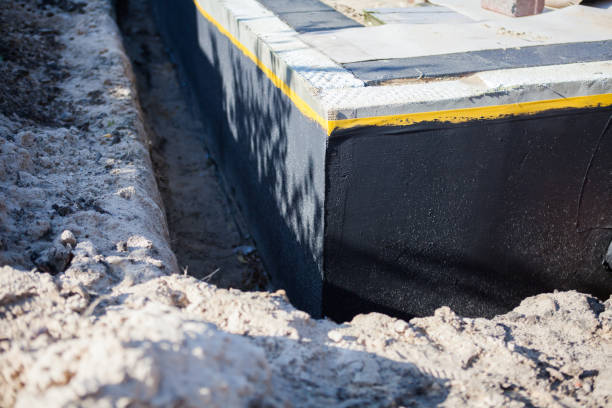 Professional Waterproofing technician working in Lowell, MI